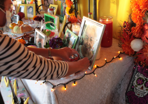 Buena Gente adding objects to altar